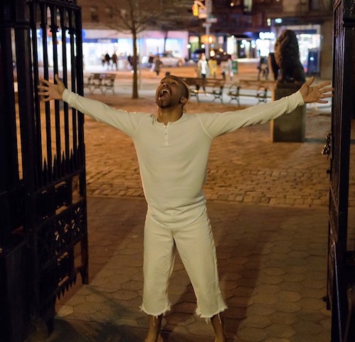 Jonathan Gonzalez outstretches his arms and opens in mouth