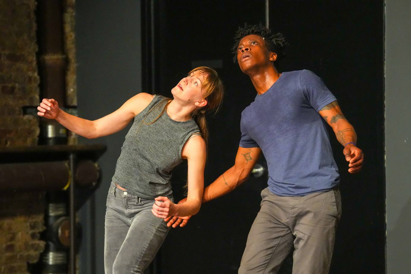 Jamie Scott and Mufutau Yusuf side by side are looking up at something rather spellbinding above them.