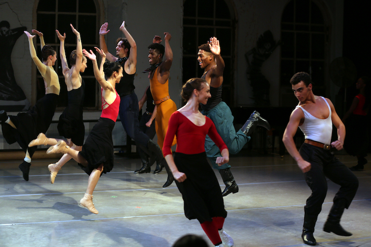 the Graham dancers arranged in male female square dancing couples face eachother and jump in exultation 